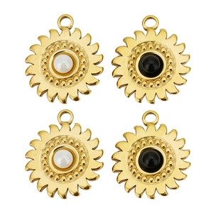 Detail of sunflower pendants with pearl and black inlay for DIY jewelry design