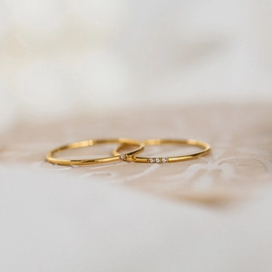 Minimalist gold titanium steel rings with delicate cubic zirconia accents for women