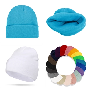 Solid knit beanie hats in multiple colors including blue and white for winter warmth