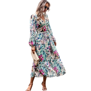Bohemian floral V-neck maxi dress with long sleeves and ruffled hem in colorful print