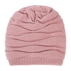 Detail view of pink knitted beanie featuring wave texture and thick ribbed cuff