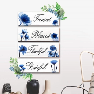 Set of four wooden wall plaques with blue floral watercolor art and inspirational quotes