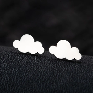 Macro shot of silver-colored cloud-shaped stud earrings in polished stainless steel finish