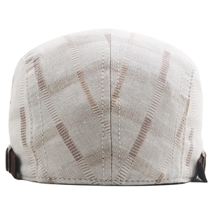 Detail view of cotton plaid beret showing back stitching and brown adjustable strap