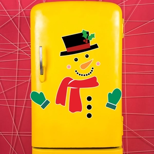 DIY Christmas snowman magnetic stickers set on a vintage yellow refrigerator surface