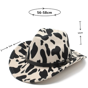 Detail of cow print cowboy hat showing 7cm brim, 12cm height and 56-58cm head circumference