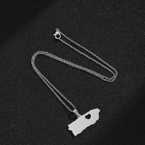 Detailed close-up of Puerto Rico map pendant with heart cutout on a silver chain