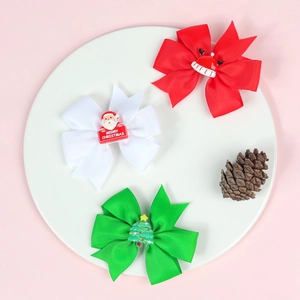 Three-piece set of Christmas bow hair clips featuring Santa, tree, and hat designs