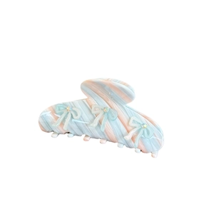 Mint and pink marble acetate hair claw clip with sparkling green rhinestone bows