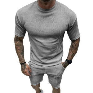 Men's grey summer casual two-piece set featuring textured knit t-shirt and drawstring shorts