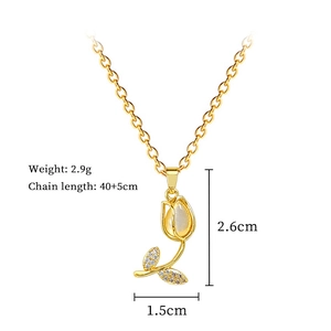 Detail view of cat eye tulip pendant dimensions 2.6cm by 1.5cm on gold chain