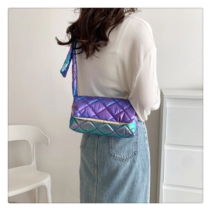 Close-up of purple quilted crossbody bag with iridescent finish and metallic gloss texture