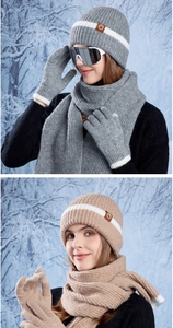 Detailed view of rib-knit winter sets with leather logo patch and touch-screen gloves
