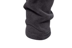 Detailed close-up of heavy polar fleece fabric and double-stitched hem on a hoodie