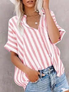 Detail of pink and white striped short sleeve shirt featuring a V-neck and button closure