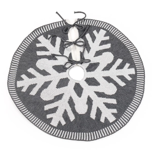 Knitted grey and white Christmas tree skirt with snowflake patterns and tie closures