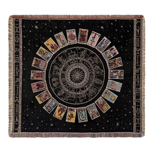 Bohemian tarot sun and zodiac tapestry with fringe edges, flat lay view for home or picnic