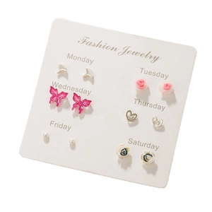Minimalist butterfly earring set with six pairs for women on white background