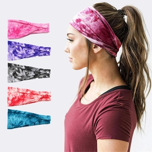 Detailed view of tie-dye sports headbands in pink, purple, grey, red, and blue colors