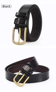 Macro detail of black leather belt with golden buckle and brown X-shaped stitching decoration