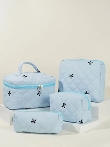 Quilted light blue 4-piece cosmetic bag set with elegant embroidery and handles
