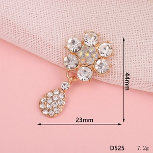 Detailed view of golden flower pendant with crystals and dimensions 44mm x 23mm