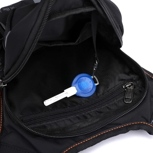 Outdoor cycling leg bag in black with orange stitching and multi-pocket interior view