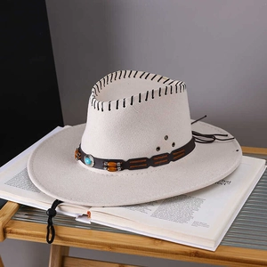 Detail of cream western cowboy hat with turquoise beads and black woven band trim
