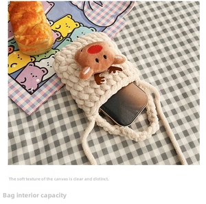 Internal view of handmade knit mini bag showing capacity for a smartphone