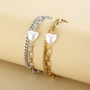 Double-layered gold and silver stainless steel chain bracelet with a heart pearl charm