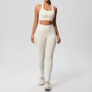 Detail of high-waisted yoga set in cream white with functional side pockets on leggings