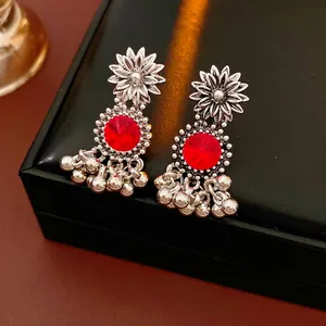 Vintage bohemian flower earrings with red gemstone and silver accents in a gift box