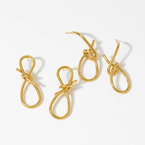 Minimalist gold knot stud earrings set in polished stainless steel for women