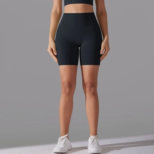 Detail view of high-waisted seamless black yoga shorts with smooth matte athletic fabric