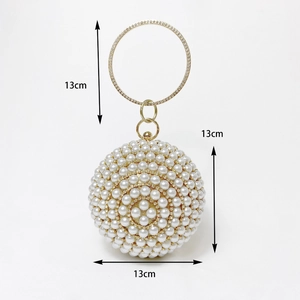 Detailed view of spherical pearl evening bag with 13cm diameter dimensions and gold handle