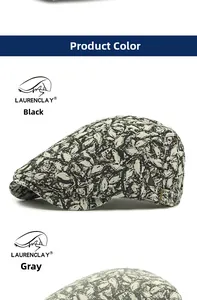 Detail view of ethnic beret with leaf pattern jacquard fabric and metal buckles
