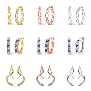 Macro view of 925 sterling silver hoop earrings with diverse twisted and paved designs