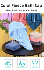 Detailed view of soft coral fleece hair towels in multiple colors with button fasteners