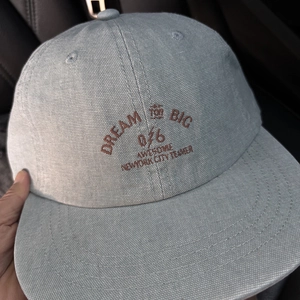 Detail of vintage hip hop canvas baseball cap featuring retro brown letter embroidery