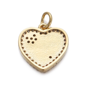 Detailed view of heart-shaped gold pendant with biscuit texture and dotted border