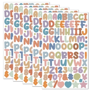 Macro shot of colorful 0.5-inch cartoon alphabet stickers in pastel macaron tones