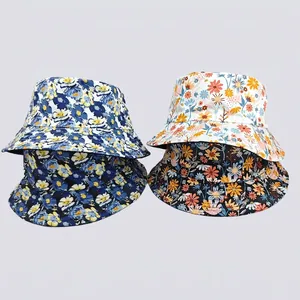 Floral print sun bucket hats in navy blue and cream white for summer outdoor protection