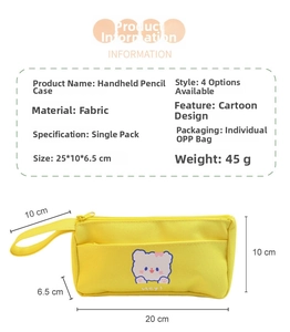 Detail view of yellow fabric pencil case featuring cute bear print and sturdy side handle