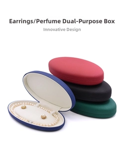Close-up of oval PU leather jewelry box for pearl necklaces and earrings with ivory lining