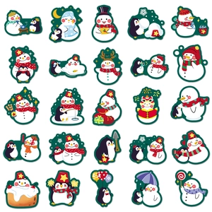 Flat lay matrix of 25 cute snowman and penguin stickers for Christmas decoration