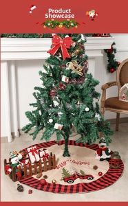 Detail of burlap Christmas tree skirt with red plaid border and vintage truck embroidery