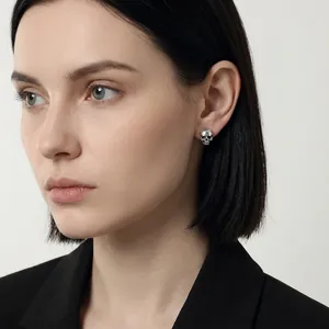 Pioneer design skull stud earrings in silver metal finish for a bold fashion statement