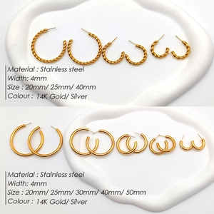 Detail of twisted and smooth 14K gold plated stainless steel hoop earrings in various sizes