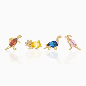 Macro detail of dinosaur earrings with gold plating and colorful zircon stones