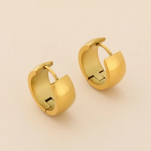 Detail of 18K gold-plated wide hoop earrings with a brushed matte finish and hinge closure